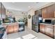 Modern kitchen with granite countertops and stainless steel appliances at 161 Old Moss Cir, Deland, FL 32724