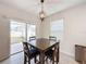 Kitchen dining area with table and four chairs, view of backyard at 1623 Aspen Ave, Davenport, FL 33837