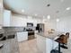 Modern kitchen with granite countertops and white cabinets at 1623 Aspen Ave, Davenport, FL 33837