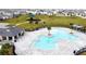 Community pool with a large deck and lounging area at 1623 Aspen Ave, Davenport, FL 33837