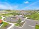 Community center with circular drive and landscaping at 1735 Three Bars Rd, Kissimmee, FL 34744