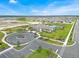 Community center with circular drive and landscaping at 1735 Three Bars Rd, Kissimmee, FL 34744