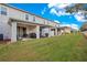 Spacious backyard with covered patio and grassy area at 190 Mitchell Creek Way, Oviedo, FL 32765