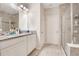 Double vanity bathroom with granite countertop at 190 Mitchell Creek Way, Oviedo, FL 32765