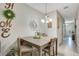 Simple dining room with a wooden table and chairs at 190 Mitchell Creek Way, Oviedo, FL 32765