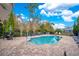 Community pool with plenty of lounge chairs at 190 Mitchell Creek Way, Oviedo, FL 32765