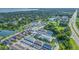 Aerial view of townhouses near lake and preserve at 2102 Gopher Tortoise Ter, Oakland, FL 34787