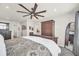 Main bedroom with king bed, armoire, and full-length mirror at 2102 Gopher Tortoise Ter, Oakland, FL 34787