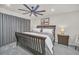 Spacious bedroom with king-size bed, nightstands and ceiling fan at 2102 Gopher Tortoise Ter, Oakland, FL 34787