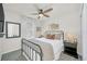 Cozy bedroom featuring a metal bed frame and window seating at 2102 Gopher Tortoise Ter, Oakland, FL 34787