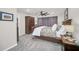 Main bedroom with a king-size bed, dresser and large closet at 2102 Gopher Tortoise Ter, Oakland, FL 34787