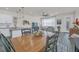 Bright dining area with wooden table and kitchen access at 2102 Gopher Tortoise Ter, Oakland, FL 34787