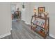 Foyer with gray wood-look floors, console table, and view into dining room at 2102 Gopher Tortoise Ter, Oakland, FL 34787