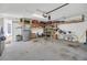 Garage with shelving, refrigerator, and bicycle at 2102 Gopher Tortoise Ter, Oakland, FL 34787