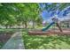 Community playground with slide and shaded areas at 2102 Gopher Tortoise Ter, Oakland, FL 34787