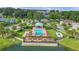 Community pool with pergola and picnic tables at 2102 Gopher Tortoise Ter, Oakland, FL 34787