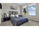 Bright bedroom with water views and a comfortable bed at 219 Blue Cypress Dr, Groveland, FL 34736