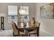 Elegant dining room with a dark wood table and neutral decor at 219 Blue Cypress Dr, Groveland, FL 34736