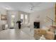 Living room featuring a neutral color scheme and ample natural light at 219 Blue Cypress Dr, Groveland, FL 34736