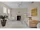 Living room with a neutral color palette, comfortable seating, and a cozy atmosphere at 219 Blue Cypress Dr, Groveland, FL 34736