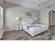 Main bedroom with a king-size bed and plenty of natural light at 219 Blue Cypress Dr, Groveland, FL 34736