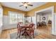 Bright dining room with a round table and built-in shelving at 220 Riverview Blvd, Daytona Beach, FL 32118