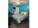 Bedroom with a double bed and teal walls at 2216 Grand Cayman Ct # 1411, Kissimmee, FL 34741