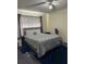 Main bedroom with a queen-size bed and ceiling fan at 2216 Grand Cayman Ct # 1411, Kissimmee, FL 34741