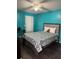 Bedroom with a double bed and teal walls at 2216 Grand Cayman Ct # 1411, Kissimmee, FL 34741