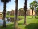 Apartment building with lake view and lush landscaping at 2216 Grand Cayman Ct # 1411, Kissimmee, FL 34741