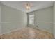 Green bedroom with white trim, ceiling fan, and ceramic tile flooring at 233 Bluejay Way, Orlando, FL 32828