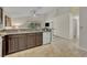 Well-equipped kitchen with granite counters and an adjacent eating area at 233 Bluejay Way, Orlando, FL 32828