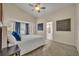 Bright main bedroom featuring vaulted ceiling, large windows, and ensuite bathroom access at 233 Bluejay Way, Orlando, FL 32828