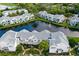 Aerial view of waterfront community with lake and fountain at 2512 Woodgate Blvd # 105, Orlando, FL 32822