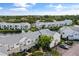 Aerial view of condo community near water at 2512 Woodgate Blvd # 105, Orlando, FL 32822