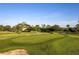 Green golf course putting green with sand trap at 282 S Fox Chase Pt, Longwood, FL 32779