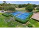 Two tennis courts surrounded by green landscaping at 282 S Fox Chase Pt, Longwood, FL 32779