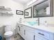 Modern bathroom with a glass sink and white cabinets at 3211 Sunrise Walk, Kissimmee, FL 34747