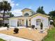 Front view of a single-story house with a landscaped yard at 3211 Sunrise Walk, Kissimmee, FL 34747