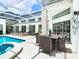 Outdoor patio with table and chairs for dining al fresco at 3211 Sunrise Walk, Kissimmee, FL 34747