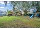 Expansive backyard with playground and home view at 33925 Terragona Dr, Sorrento, FL 32776