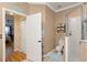 Bathroom with toilet, shower, and linen shelving at 33925 Terragona Dr, Sorrento, FL 32776