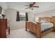 Bright bedroom with wood bed frame and dresser at 33925 Terragona Dr, Sorrento, FL 32776