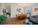 Inviting dining room with wood floors, crown molding, and pendant lighting at 33925 Terragona Dr, Sorrento, FL 32776