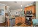 Well-equipped kitchen featuring stainless steel appliances and light wood cabinets at 33925 Terragona Dr, Sorrento, FL 32776