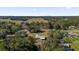 Aerial view of a single-story home on a large lot with scenic landscape at 38100 Ricker Dr, Lady Lake, FL 32159