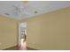 Bedroom with wood floors and access to office at 38100 Ricker Dr, Lady Lake, FL 32159