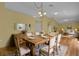 Farmhouse style dining room with a large wooden table at 38100 Ricker Dr, Lady Lake, FL 32159