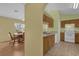 Simple kitchen with light wood cabinets and white appliances at 38100 Ricker Dr, Lady Lake, FL 32159