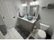 Updated bathroom with dual sinks, modern vanity, and toilet at 3840 Eversholt St, Clermont, FL 34711